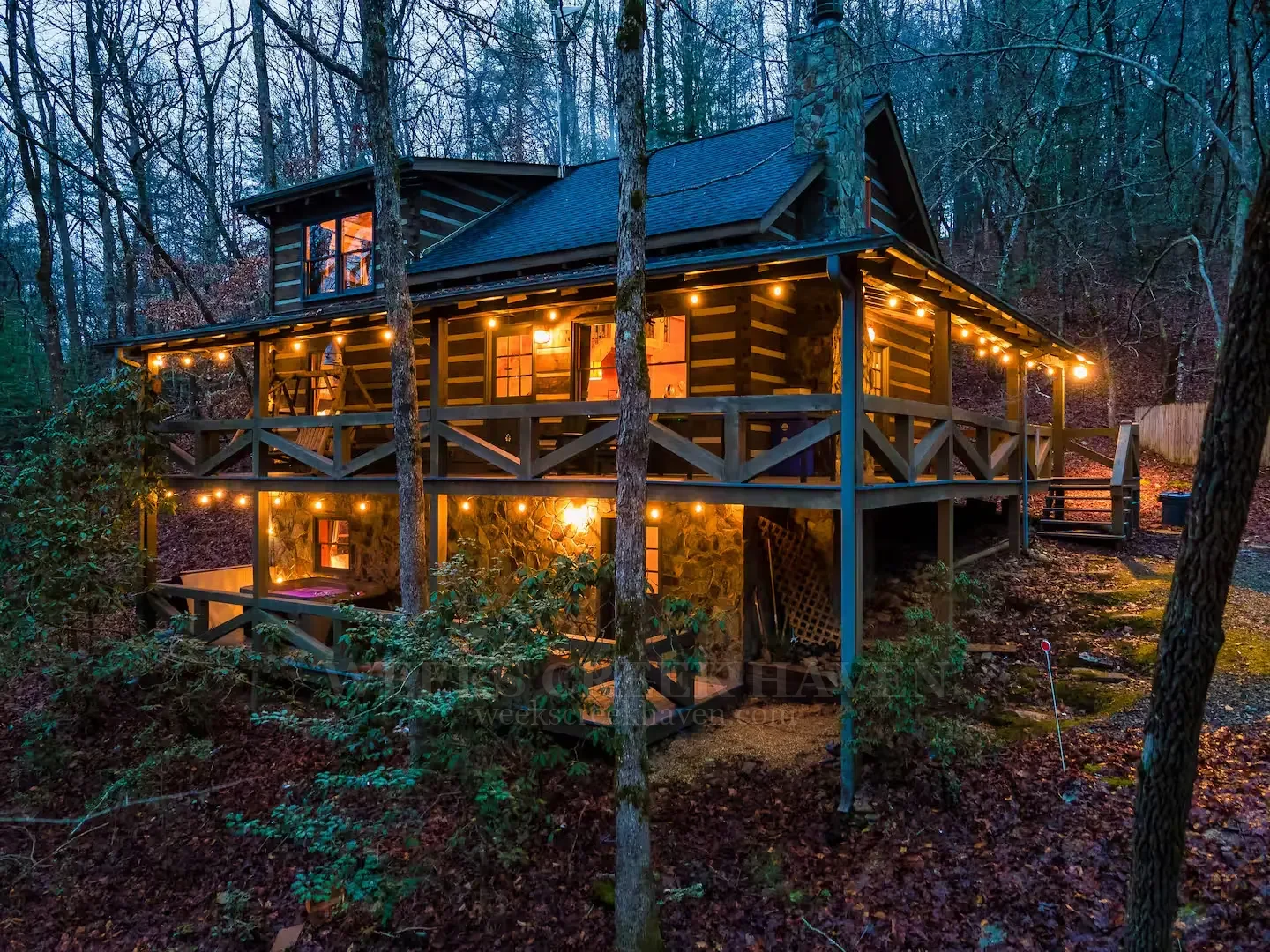 Cabin lights glowing at evening